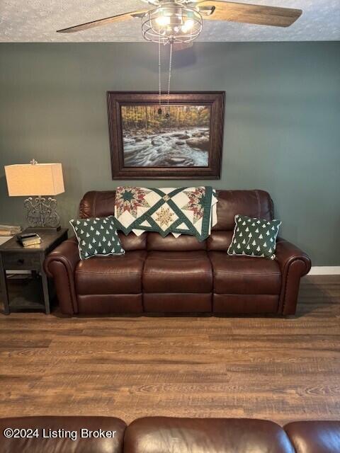 116 Spring Meadow Cir, Campbellsville, KY 42718 - living area featuring a ceiling fan, wood finished floors, baseboards, and a textured ceiling