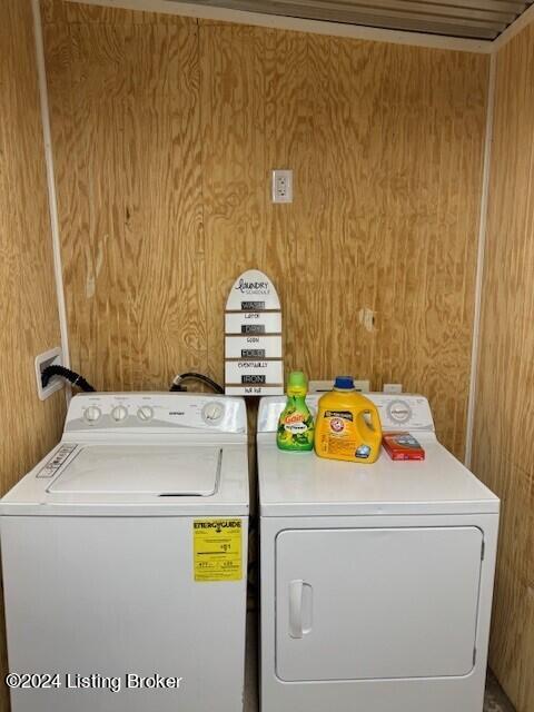 116 Spring Meadow Cir, Campbellsville, KY 42718 - clothes washing area with independent washer and dryer and wood walls