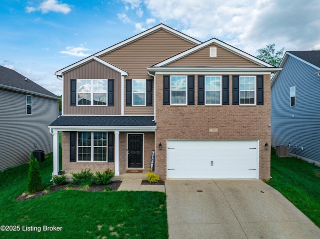 11905 Parkside Vista Ln, Louisville, KY 40229 - traditional-style house with concrete driveway, a garage, central air condition unit, and a front yard