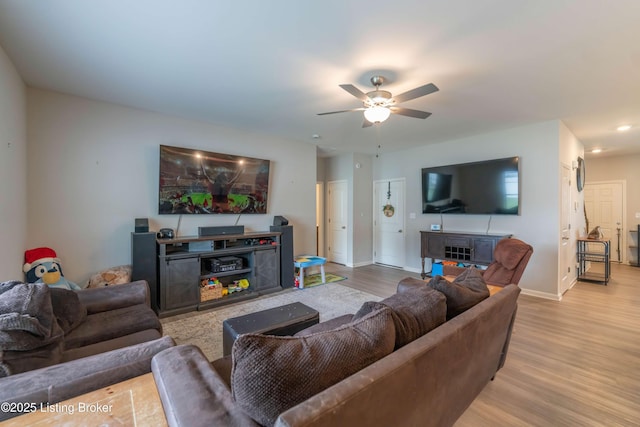 11905 Parkside Vista Ln, Louisville, KY 40229 - living area with wood finished floors, ceiling fan, baseboards, and a fireplace