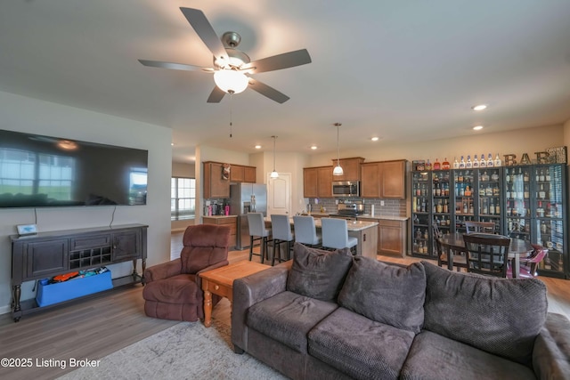 11905 Parkside Vista Ln, Louisville, KY 40229 - living room with wood finished floors, ceiling fan, and recessed lighting