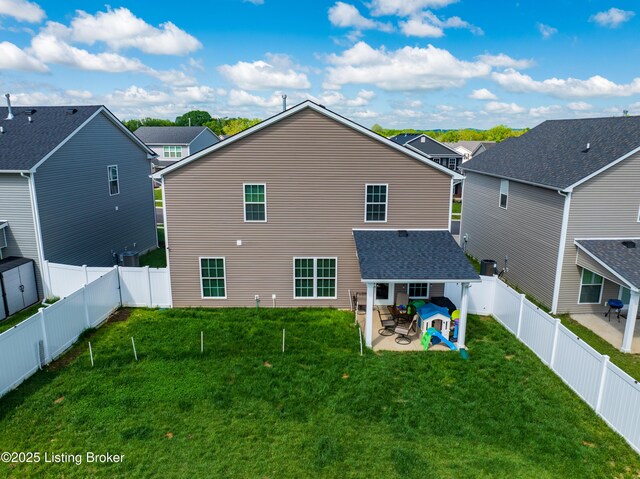 11905 Parkside Vista Ln, Louisville, KY 40229 - back of house featuring a patio and a residential view