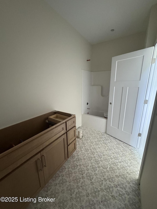 309 Ashwood Ave, Elizabethtown, KY 42701 - bathroom featuring toilet and shower / bathtub combination
