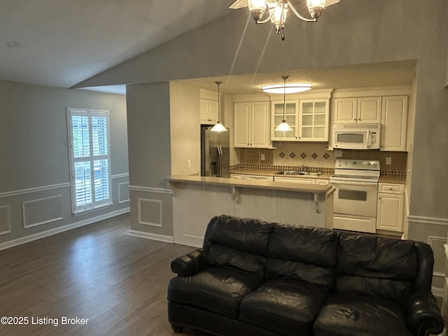3809 Chamberlain Ln Unit D, Louisville, KY 40241 - kitchen featuring white appliances, a sink, vaulted ceiling, dark wood-type flooring, and glass insert cabinets