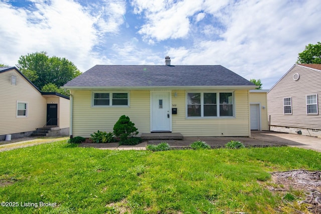 522 Lee Rd, Elizabethtown, KY 42701 - bungalow featuring entry steps, a front lawn, a chimney, roof with shingles, and a patio
