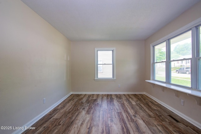 522 Lee Rd, Elizabethtown, KY 42701 - spare room featuring healthy amount of natural light, dark wood-style floors, and baseboards