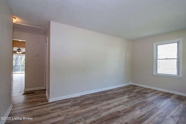 522 Lee Rd, Elizabethtown, KY 42701 - spare room featuring wood finished floors, a textured ceiling, and baseboards