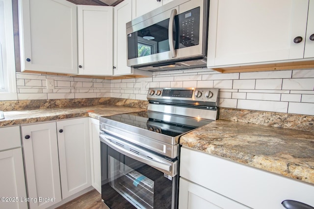 522 Lee Rd, Elizabethtown, KY 42701 - kitchen with appliances with stainless steel finishes, white cabinets, decorative backsplash, and light stone counters