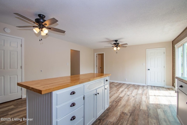 522 Lee Rd, Elizabethtown, KY 42701 - kitchen with butcher block counters, ceiling fan, white cabinetry, wood finished floors, and a textured ceiling