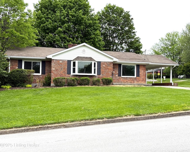 701 Dogwood Dr, Elizabethtown, KY 42701 - ranch-style home featuring brick siding, a front yard, a carport, and roof with shingles