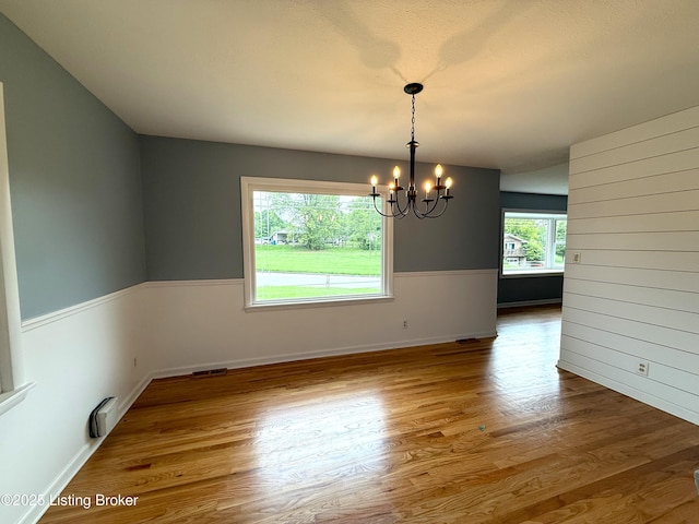 701 Dogwood Dr, Elizabethtown, KY 42701 - unfurnished dining area featuring a chandelier, wood finished floors, and baseboards