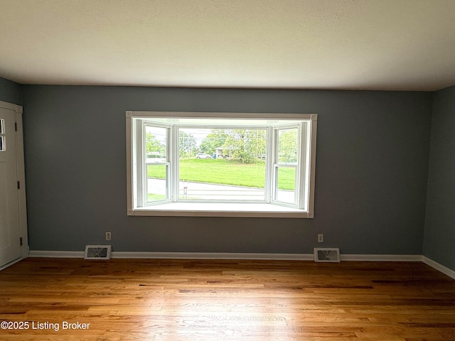 701 Dogwood Dr, Elizabethtown, KY 42701 - unfurnished room featuring wood finished floors and baseboards