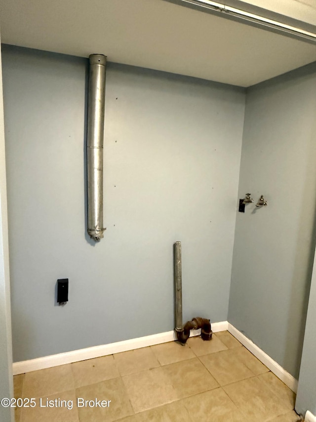 701 Dogwood Dr, Elizabethtown, KY 42701 - clothes washing area with light tile patterned floors and baseboards