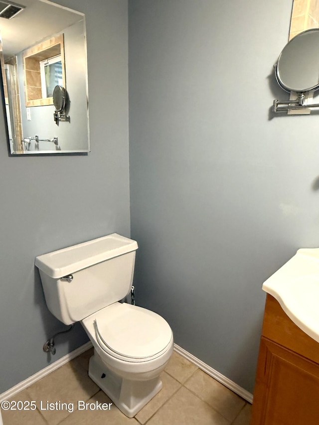 701 Dogwood Dr, Elizabethtown, KY 42701 - bathroom featuring baseboards, tile patterned floors, toilet, and vanity