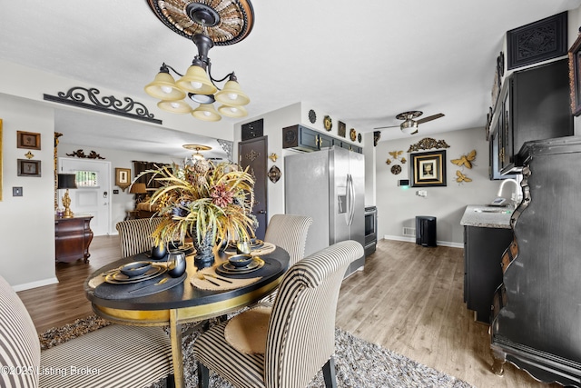 1507 Hobart Ct, Louisville, KY 40216 - dining room with a chandelier, wood finished floors, and baseboards