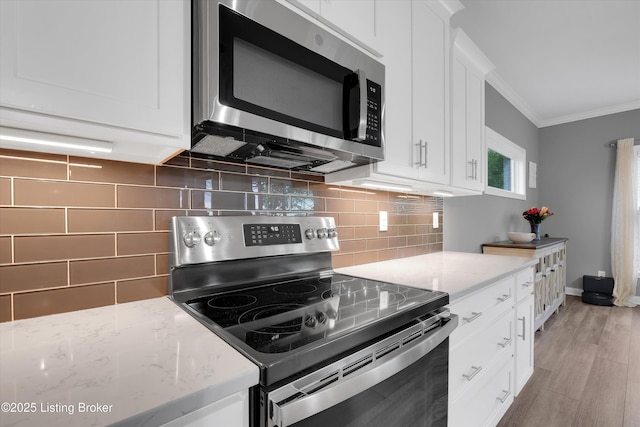 361 Williamsburg Dr, Mt Washington, KY 40047 - kitchen featuring stainless steel appliances, crown molding, white cabinets, decorative backsplash, and light stone counters