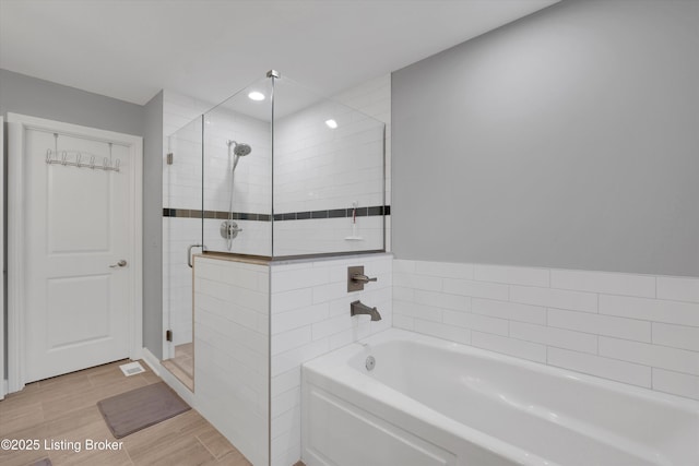 361 Williamsburg Dr, Mt Washington, KY 40047 - full bath with a stall shower, a bath, wood finished floors, and recessed lighting