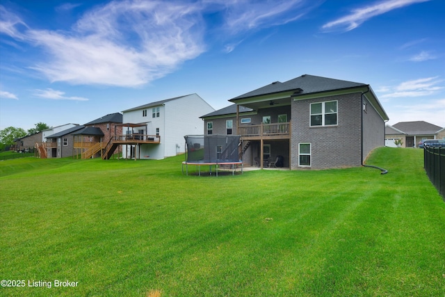 361 Williamsburg Dr, Mt Washington, KY 40047 - back of property with stairway, a trampoline, a wooden deck, and ceiling fan