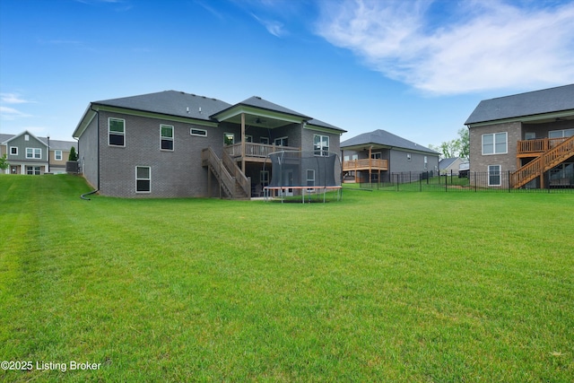 361 Williamsburg Dr, Mt Washington, KY 40047 - back of property with stairway, a trampoline, a wooden deck, and a ceiling fan