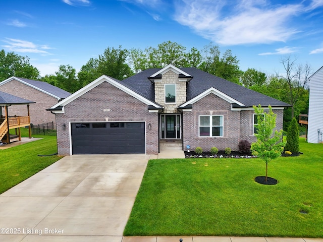 361 Williamsburg Dr, Mt Washington, KY 40047 - view of front facade with an attached garage, concrete driveway, a front yard, brick siding, and stone siding