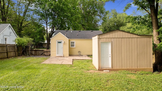 7802 Edna M Rd, Louisville, KY 40258 - back of house featuring a patio, an outbuilding, and a storage shed