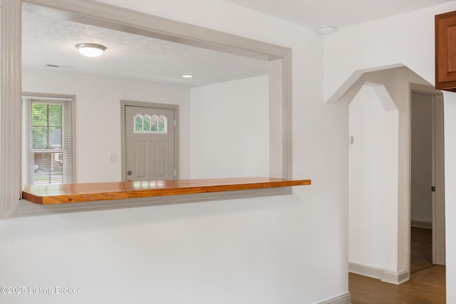 7802 Edna M Rd, Louisville, KY 40258 - corridor with baseboards, wood finished floors, and arched walkways