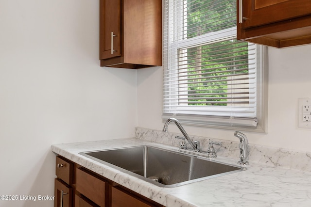 7802 Edna M Rd, Louisville, KY 40258 - kitchen featuring a sink, light countertops, and brown cabinets