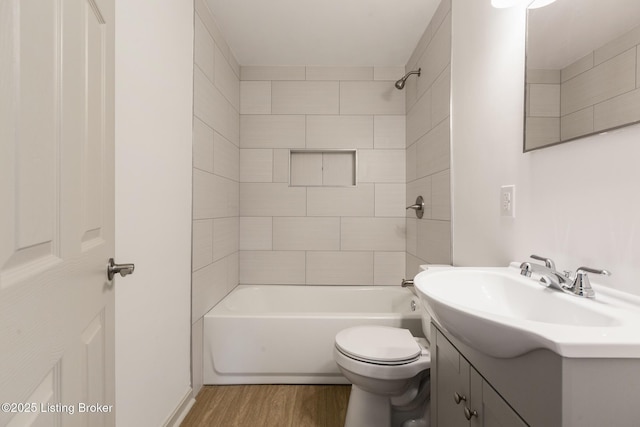 7802 Edna M Rd, Louisville, KY 40258 - full bath featuring wood finished floors, tub / shower combination, toilet, and vanity