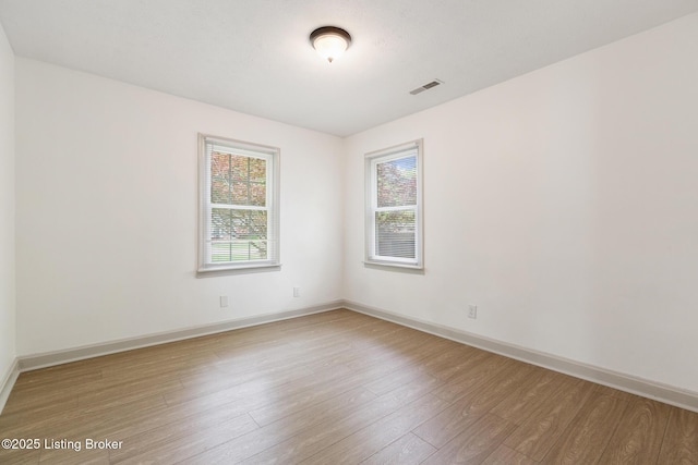 7802 Edna M Rd, Louisville, KY 40258 - spare room featuring wood finished floors and baseboards