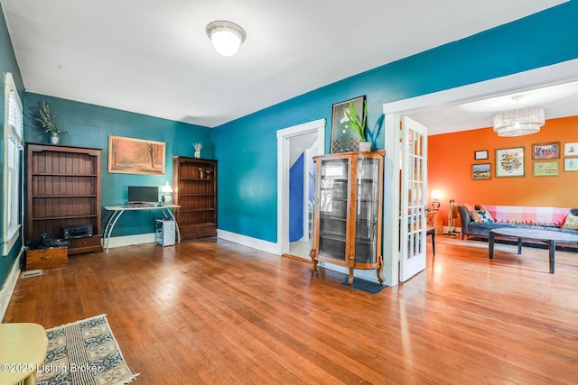 1830 Edgeland Ave, Louisville, KY 40204 - living area featuring wood finished floors and baseboards
