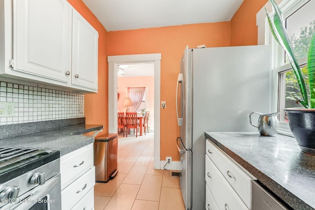 1830 Edgeland Ave, Louisville, KY 40204 - kitchen with dark countertops, healthy amount of natural light, and white cabinets