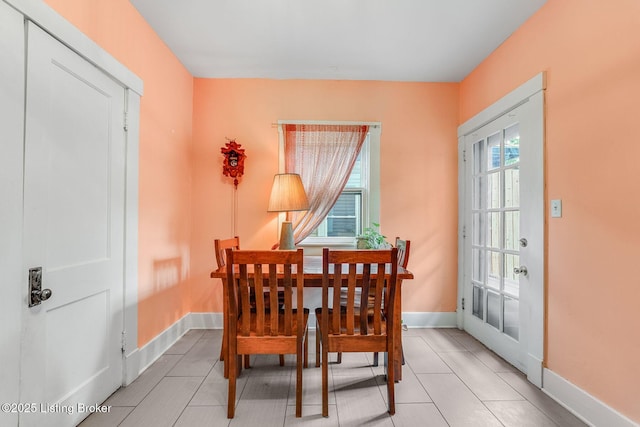 1830 Edgeland Ave, Louisville, KY 40204 - dining room featuring light tile patterned flooring and baseboards