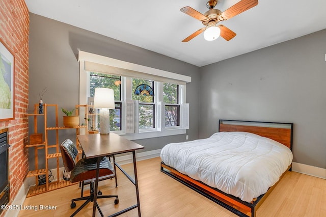 1830 Edgeland Ave, Louisville, KY 40204 - bedroom with baseboards, wood finished floors, and a desk