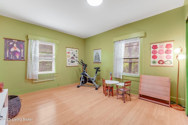 1830 Edgeland Ave, Louisville, KY 40204 - workout area featuring plenty of natural light, wood finished floors, and baseboards