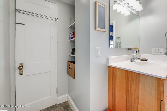 1830 Edgeland Ave, Louisville, KY 40204 - bathroom with vanity, baseboards, and stone finish floors