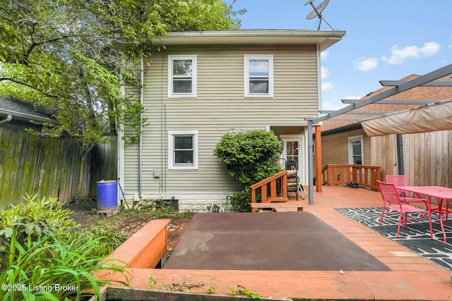 1830 Edgeland Ave, Louisville, KY 40204 - rear view of property featuring a wooden deck, fence, a pergola, and outdoor dining space