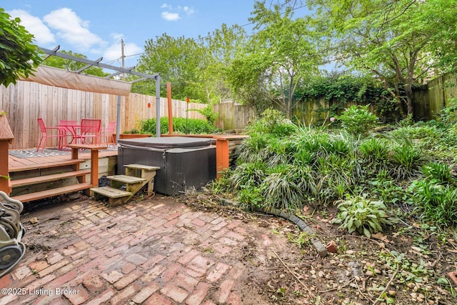 1830 Edgeland Ave, Louisville, KY 40204 - view of patio / terrace with a hot tub, a fenced backyard, and a wooden deck