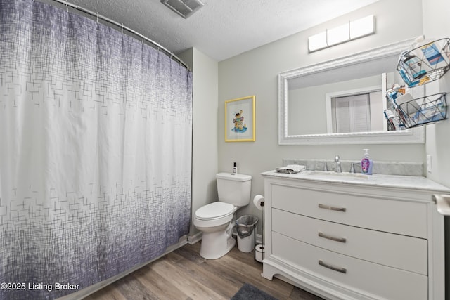 11310 Corston Ct, Louisville, KY 40241 - bathroom featuring wood finished floors, toilet, a textured ceiling, and vanity