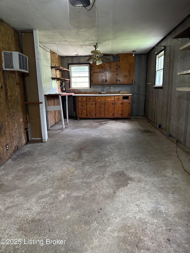 unfurnished living room featuring unfinished concrete floors and ceiling fan