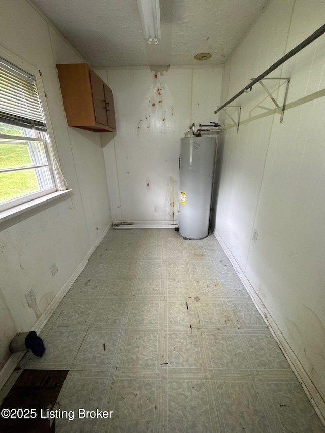 utility room featuring water heater