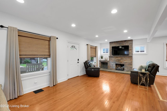 2410 Sherry Rd, Louisville, KY 40217 - living area with a fireplace, light wood-style floors, recessed lighting, and baseboards