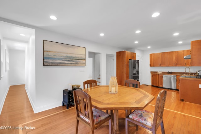 2410 Sherry Rd, Louisville, KY 40217 - dining space with light wood finished floors, stairs, recessed lighting, and baseboards