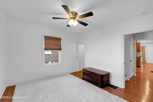 2410 Sherry Rd, Louisville, KY 40217 - spare room with baseboards, ceiling fan, wood finished floors, and a smoke detector