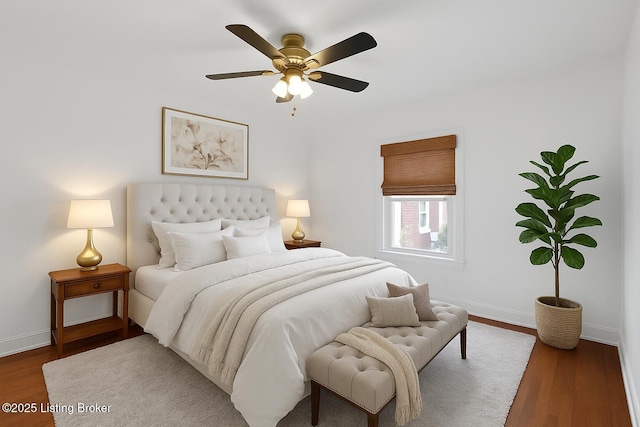 2410 Sherry Rd, Louisville, KY 40217 - bedroom featuring baseboards, wood finished floors, and ceiling fan