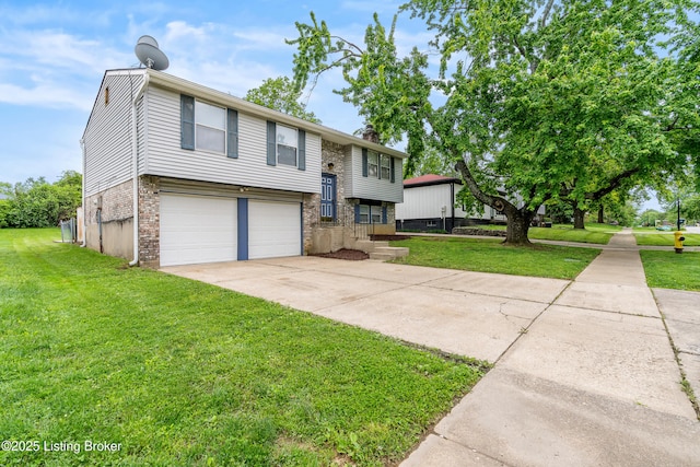 raised ranch with brick siding, driveway, a garage, and a front yard
