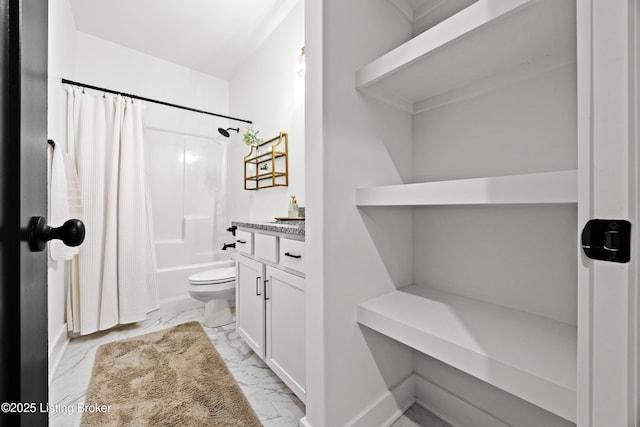 full bath with marble look tiles, shower / bathtub combination with curtain, toilet, vanity, and baseboards