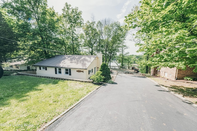 656 Hinton Hills Loop, Hardinsburg, KY 40143 - view of front facade featuring a chimney, metal roof, and driveway