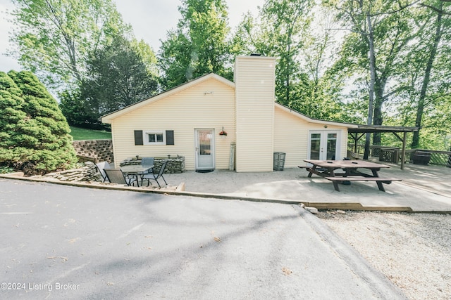 656 Hinton Hills Loop, Hardinsburg, KY 40143 - rear view of property with french doors, a patio, and a chimney