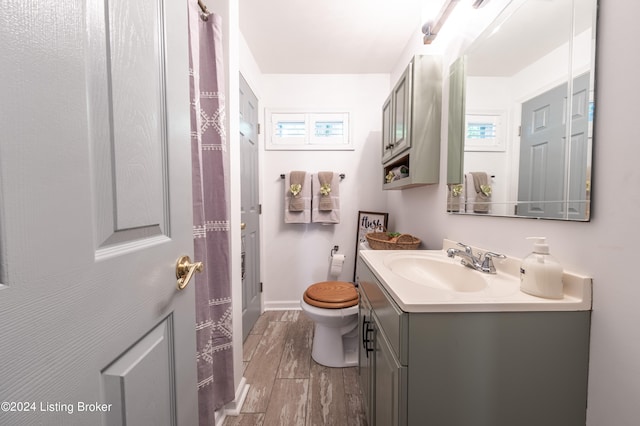 656 Hinton Hills Loop, Hardinsburg, KY 40143 - full bathroom with wood finished floors, vanity, toilet, and baseboards