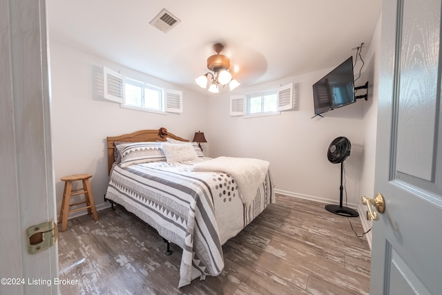 656 Hinton Hills Loop, Hardinsburg, KY 40143 - bedroom featuring wood finished floors, multiple windows, baseboards, and ceiling fan